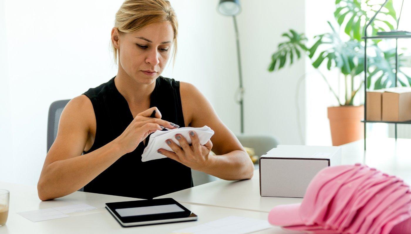 person making their designs for their merch shop